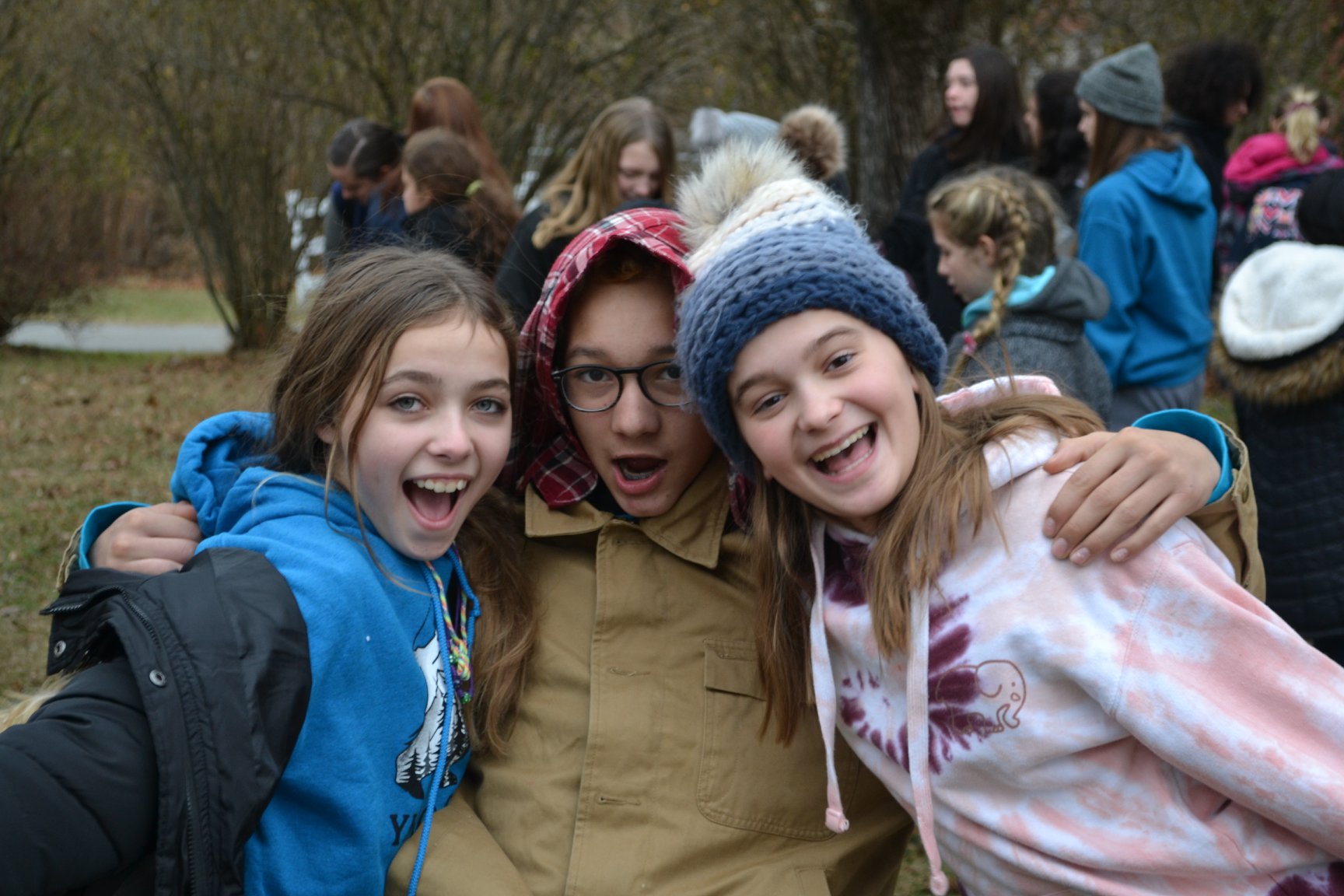 Three Girls Hugging at Camp
