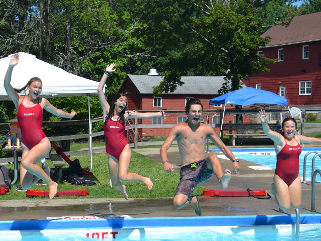 Kids jumping into pool