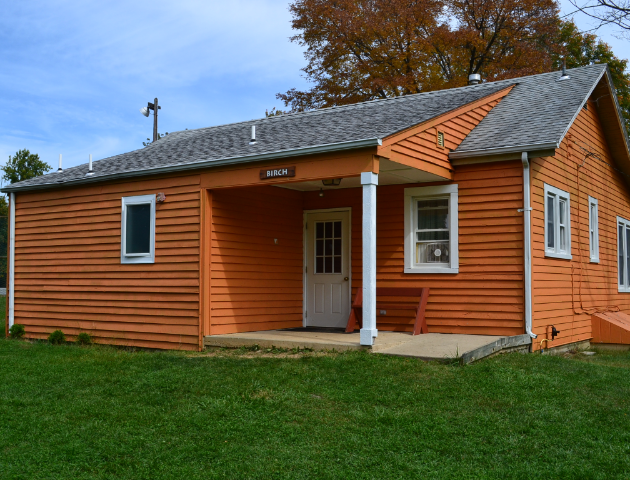 An orange wooden cabin.